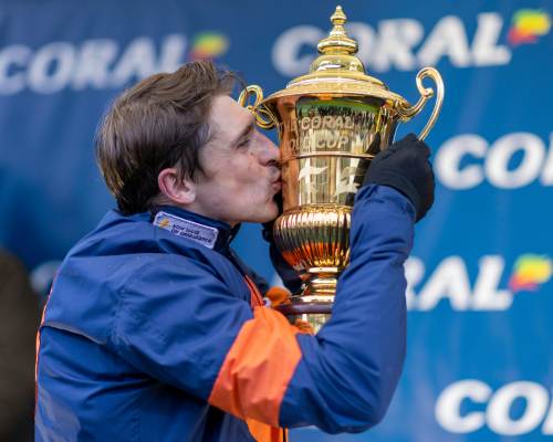 Jockey Kissing Coral Gold Cup at Newbury Racecourse