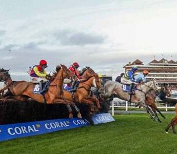 Horses Jumping Fence at Coral Gold Cup Newbury Racecourse